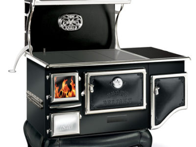 A black stove with a fire in it.