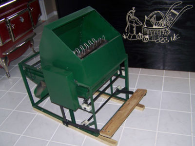 A green machine in a kitchen.